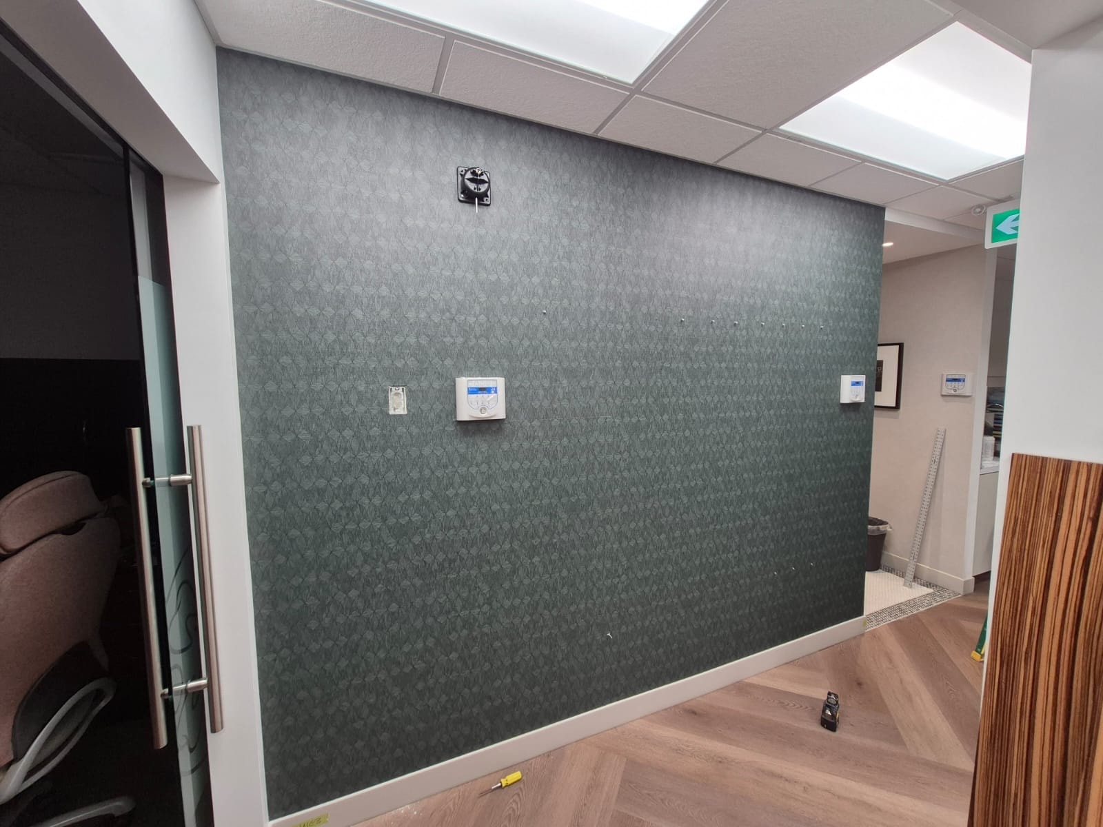 Modern office interior with green accent wall
