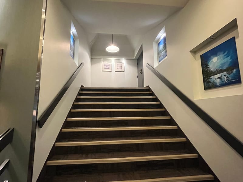 Modern staircase with metal railings